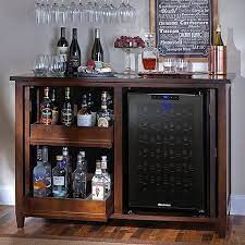It's sized just right for a mini fridge (we got the 2.6 cubic feet one) and a small microwave, with still lots of room for snacks or dinnerware. Firenze Mezzo Wine And Spirits Credenza Espresso With Wine Refrigerator Bar Furniture Wine Credenza Bars For Home