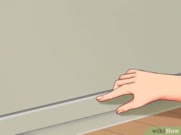 تثبيت مشمع على الأرضية Wikihow