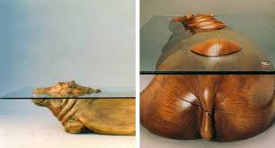 Each piece of furniture in the collection happens to be supported by a bronze sculpture of the animal that inspired its name. Derek Pearce Hippo Table And Other Water Tables Create The Illusion Of Animals Submerged Under Water