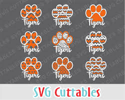 Cub tiger real jumping vector silhouette face. Pin By Stephanie King On Bottle Cap Images Tiger Paw Print Tiger Paw Free Svg
