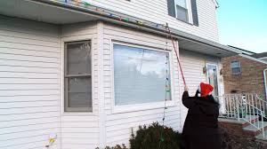 These are plastic clips that fasten we use platic light hangers that come in 3 different style. Can You Hang Christmas Lights Without A Ladder With This Light Hanging Kit Rachael Ray Show