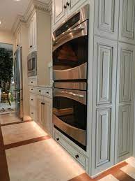 Toe Kick Lighting With Led Lighting Strips White Cabinets With Stainless Steel Ovens Appliances Kitchen Dinning Room Double Oven Kitchen Kitchen Remodel