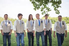 Casual Groomsmen In Jeans And Blue Ties Casual Groomsmen Denim Wedding Casual Groomsmen Attire A model sitting on a stool wearing a cream colored long sleeve blouse with puff sleeves and blue high waisted jeans. casual groomsmen in jeans and blue ties