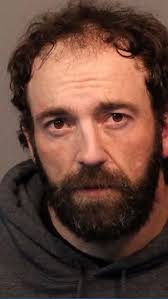 Man arrested after hitting victim with car near Mogul