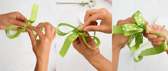 Secure the loops made in the ribbon by using a wire. Diy How To Make A Florist Bow The Koch Blog