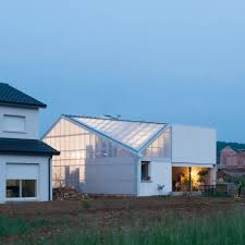 One Half Of This House In Northeast France Has A Tiled Roof And Rendered Walls While The Other Is Clad In Corrug Roof Architecture Architecture House Exterior