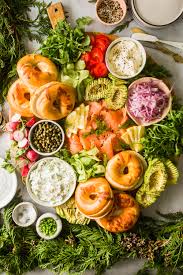 It adorns appetizer trays at parties, serves as a gourmet entrée at restaurants and is a luxury addition to breakfasts, lunch and dinners. How To Create A Lox And Bagel Brunch Board Lenaskitchen