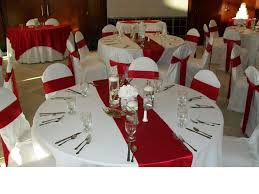 Red Crepe Back Satin Table Runners On White Poly Base Linens With Matching White Chair Covers And Crepe White Chair Covers Red And White Weddings Chair Sashes