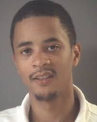 Person of interest in motorcyclist's death arraigned