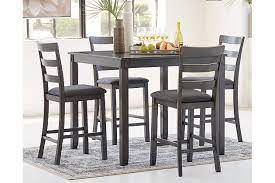 They are differentiated from more traditional dining room sets mainly because both the table and the chairs are taller. Bridson Counter Height Dining Set Ashley Furniture Homestore