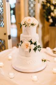 Or perhaps dahlias suit your style. Classic White Wedding Cake With Fresh Flowers Including White Garden Roses White Ranunculus White Peonies Wedding Cakes Fresh Flower Cake White Ranunculus