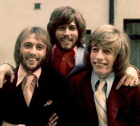 Twins Maurice and Robin Gibb of the Bee Gees, born today in 1949, with  their older brother and bandmate, Barry Gibb. ⁠ Forming a skiffle group in  1955 called The Rattlesnakes during