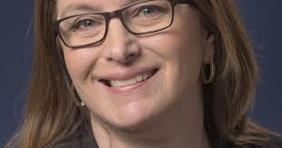 Trine promotes Floto in accreditation role