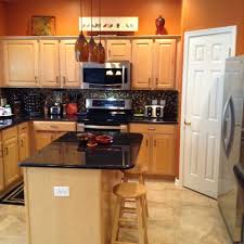 Burnt Orange Kitchen With New Tile Flooring Orange Kitchen Walls Orange Kitchen Decor Kitchen Dinning Room