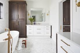This magnificent bathroom features white fiorita granite countertops. Tranquil Brown White Master Bath Crystal Cabinets