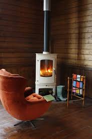 We offer a lot of wood burning stoves for you to choose from, in stock and ready for delivery. A Wood Burning Stove Warms Up Chilly Rainy Evenings Experience Retro Chic British Style When Yo Corner Wood Stove Freestanding Fireplace Wood Burning Stove
