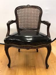 Pair Of Cane Back French Louis Xv Carved Chairs With Black Patent Leather Seats For Sale At 1stdibs