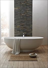Eldorado stone the bathtub takes the center place in this bathroom theme. Natural Stone Bathroom Ideas Positive Interiors Facebook