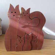 The short pieces of upcycled shipping pallets are perfect for creating a herrin. Cat Family Wooden Puzzle Wood Crafts Diy Wood Craft Projects Wood Crafts