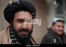 In this Feb. 28, 2019 photo, Linda Espinosa, left, a school nurse at  Freedom Middle School in the Atlanta metro-area, speaks to school  counselor, Tijuana Williams, about schoolgirls coming in to her