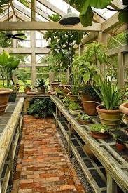The idea that you can have a greenhouse full of beautiful plants is not new. A Guide To A Greenhouse Room In Your House Backyard Greenhouse Rustic Gardens Greenhouse Gardening