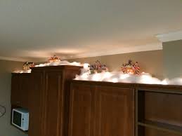 Christmas decorations should also complement modern style and. Christmas Village Above Kitchen Cabinets Above Kitchen Cabinets Christmas Kitchen Decor Kitchen Cabinets