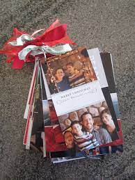 I Wasn T Ready To Toss All The Christmas Cards So I Hole Punched A Corner On Each One And Added It To A Metal Ring With Christmas Holiday Crafts Christmas Joy