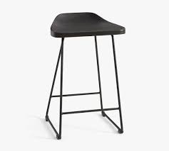 Crafted from sturdy solid wood in black that gives a sophisticated look without losing comfort. Brenner Wood Bar Counter Stools Pottery Barn