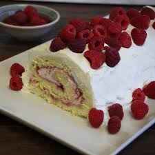An Impressive Rolled Cake Filled With Raspberry Jam And Raspberry Whipped Cream And Decorated With More Whipped Cream And Fresh Cake Roll Cake Recipes Desserts