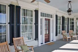 Blue window, house, balcony plants, wall, building, picturesque, shutters. Custom Exterior Shutters Houston Outdoor Wood Shutters The Shade Shop