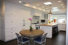 High ceilings give us a unique decorative opportunity to do some nice grain wrapping and provide an additional level of lighting on an. L Shaped Kitchen Transitional Kitchen Evars And Anderson