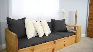 Behind the assortment of bed pillows and throw pillows is a salvaged door that works as a back rest. How To Make A Sofa That Turns Into A Bed 10 Steps With Pictures Instructables