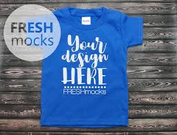 Gildan G510p Toddler Unisex Tshirt T Shirt Tee Mockup Toddler Boys Royal Blue Tshirt Mock Up On Dark Wood Backgr Unisex Tshirt Royal Blue T Shirt Blue Tshirt