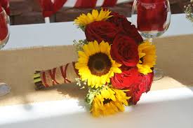 Sunflower wedding bouquets to inspire you. Sunflowers And Red Roses In A Bridal Bouquet Made At Your Local Riverside Ca Flower Sunflower Themed Wedding Sunflower Wedding Bouquet Red Roses And Sunflowers