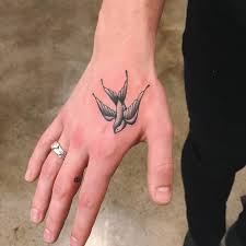 Swallow Bird Tattoo On Hand Meaning Swallow Tattoo On The Hand And Little 8 Tattoo On The Right G Tattoo On Hand Shawn Mendes Tattoos Hand Tattoos Tattoos