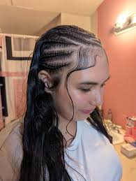 Braider offering hair braiding services