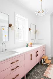 pink bathroom cabinets and fun tile for