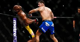 In perhaps the most horrifically ironic result in mma history, chris weidman snapped his leg throwing a kick against uriah hall. Mhngerlggixxqm