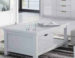 Investing in a coffee table with storage can help to get all of these items in their place, making your room look cleaner and more welcoming. Serene White Gloss Coffee Table With Drawers 2915 1