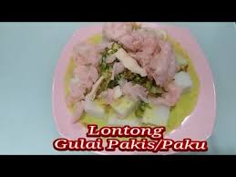 In west sumatra, a minang dish from padang pariaman is called lontong gulai pakis, lontong served with young fern leaves gulai. Lontong Gulai Pakis Paku Khas Sumatera Barat Padang Youtube