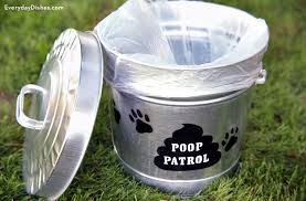 It slides onto your garbage can and buckles over the top of the lid. Poop Patrol Waste Bucket