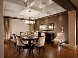 The glossy hardwood table is flanked by a set of creamy orange chairs with button tufted upholstery. Formal Dining Room With Coffered Ceiling Elegant Cream Dining Chairs Hgtv