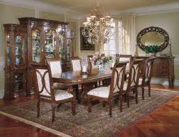 Layered rugs beneath the table help delineate the dining area, while pastel walls make the room feel more expansive and inviting. Villagio Rectangular Dining Room Set