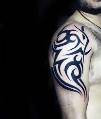 These flashy insignias are purposefully structured to exemplify a chiseled form. 75 Tribal Arm Tattoos For Men Interwoven Line Design Ideas