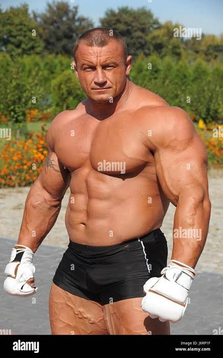 Mariusz Pudzianowski, a well-known Polish strongman and former World's  Strongest Man, is featured in this event. The image highlights his  competitive achievements and his dominance in strength sports during his  prime Stock