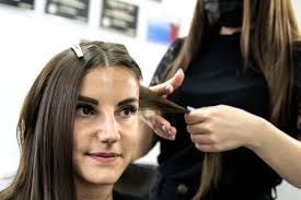 Find hair extension salons near me. Hairdresser Makes Hair Lamination In A Beauty Salon For A Girl With Brunette Hair Hair Care Concept Change Hair Woman Stock Photo 288531656