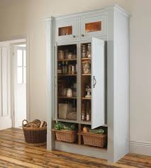 Large White Stained Wooden Pantry Storage System With Glass Door On The To Free Standing Kitchen Cabinets Kitchen Standing Cabinet Pantry Cabinet Free Standing