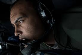 U.S. Air Force Staff Sgt. Michael Einland, an in-flight