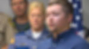 Officer wounded in deadly Ellensburg gun battle back