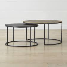 The tables are made of black metal and bronze (brass) along the edge of the countertop there is a notch. Crate And Barrel Knurl Nesting Coffee Tables Set Of Two Zola